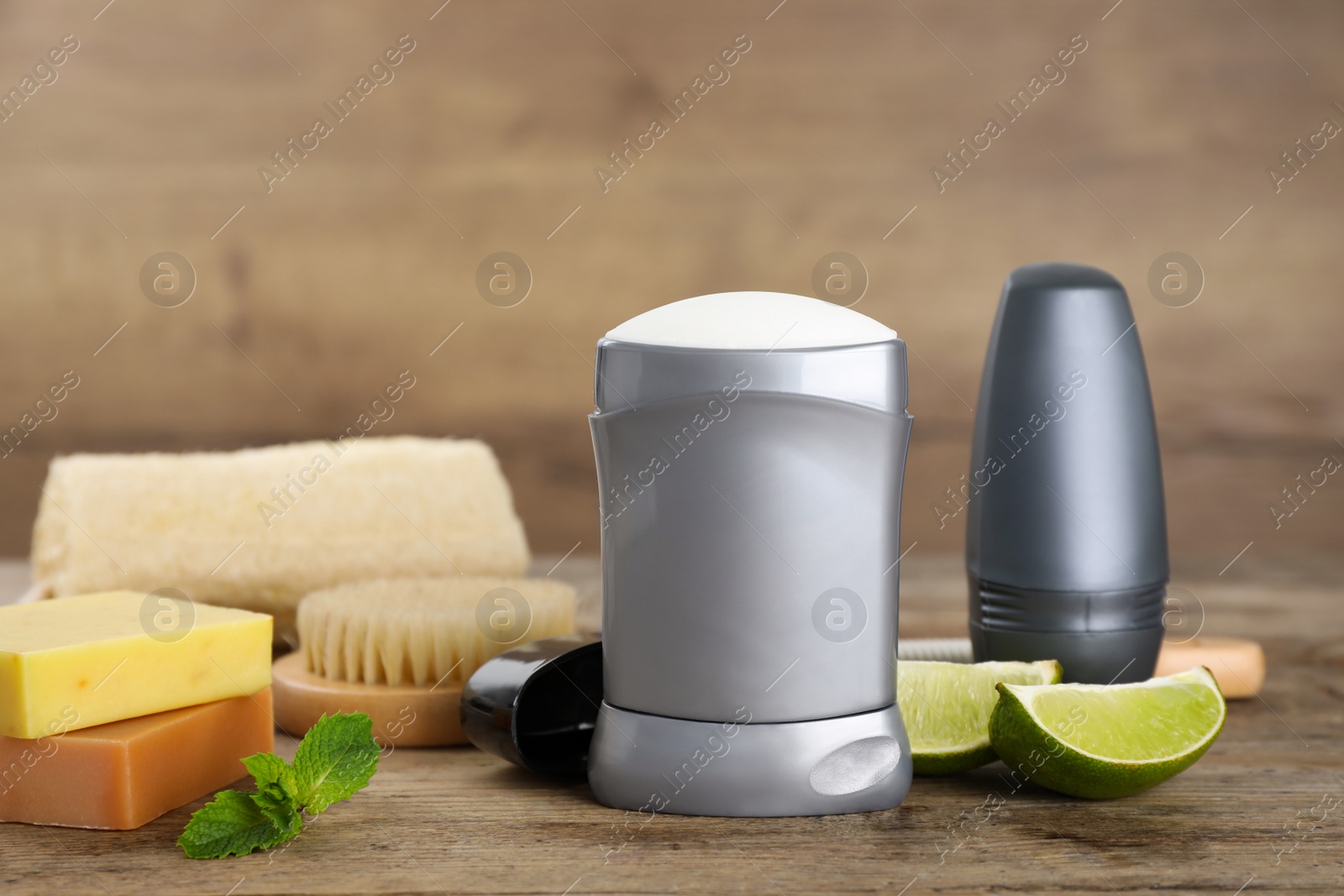 Photo of Composition with natural deodorants on wooden table