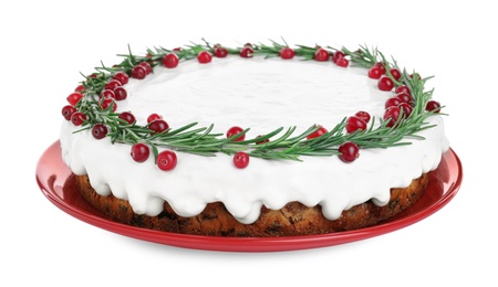 Photo of Traditional Christmas cake decorated with rosemary and cranberries isolated on white