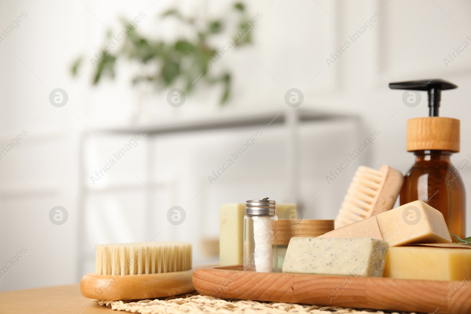 Photo of Eco friendly personal care products on wooden table indoors, space for text