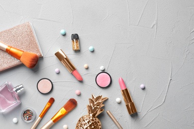 Photo of Flat lay composition with decorative cosmetics on gray background