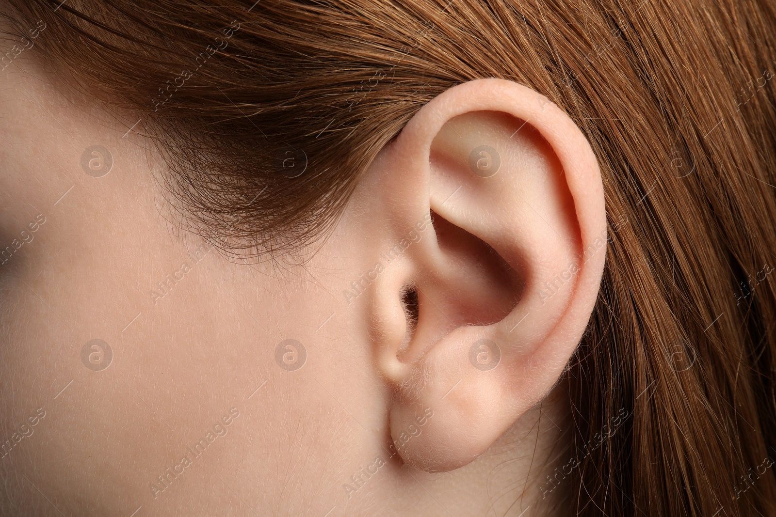 Photo of Closeup view of woman, focus on ear