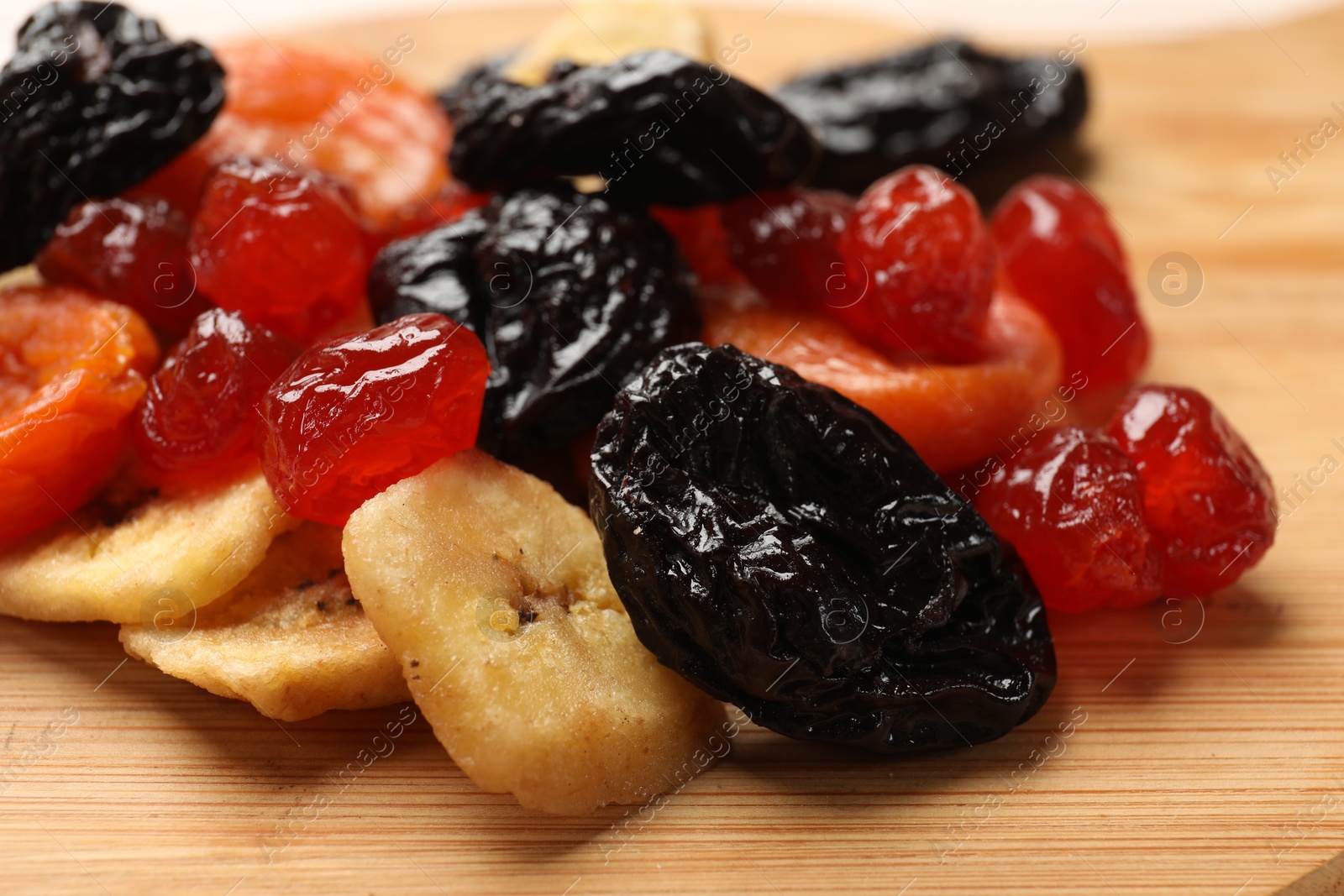 Photo of Mix of delicious dried fruits on table, closeup