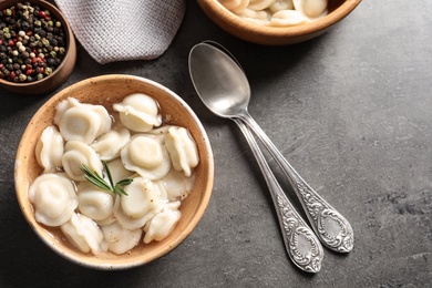 Bowl of tasty dumplings served on table, top view. Space for text