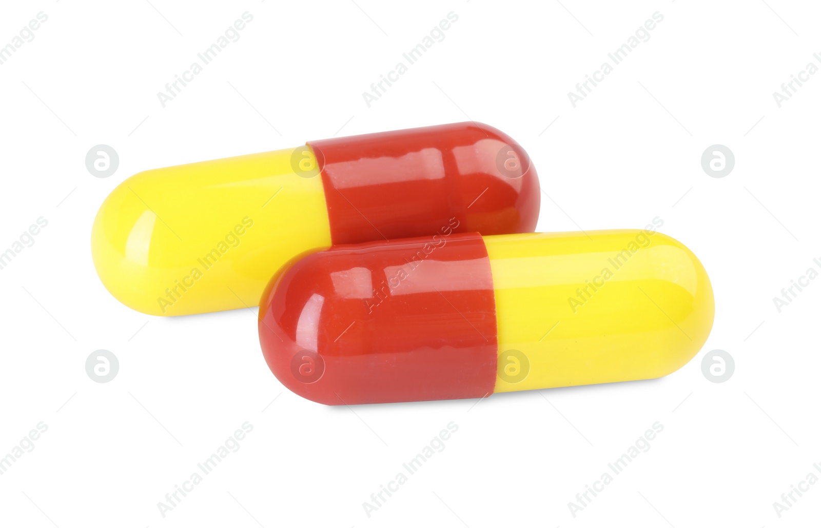 Photo of Two antibiotic pills isolated on white. Medicinal treatment