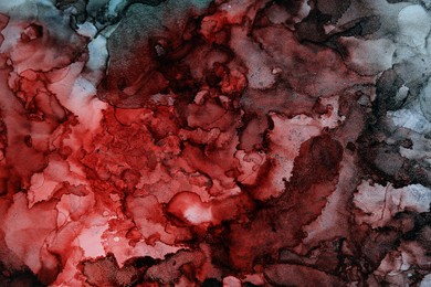 Photo of Abstract liquid ink art painting as background, top view