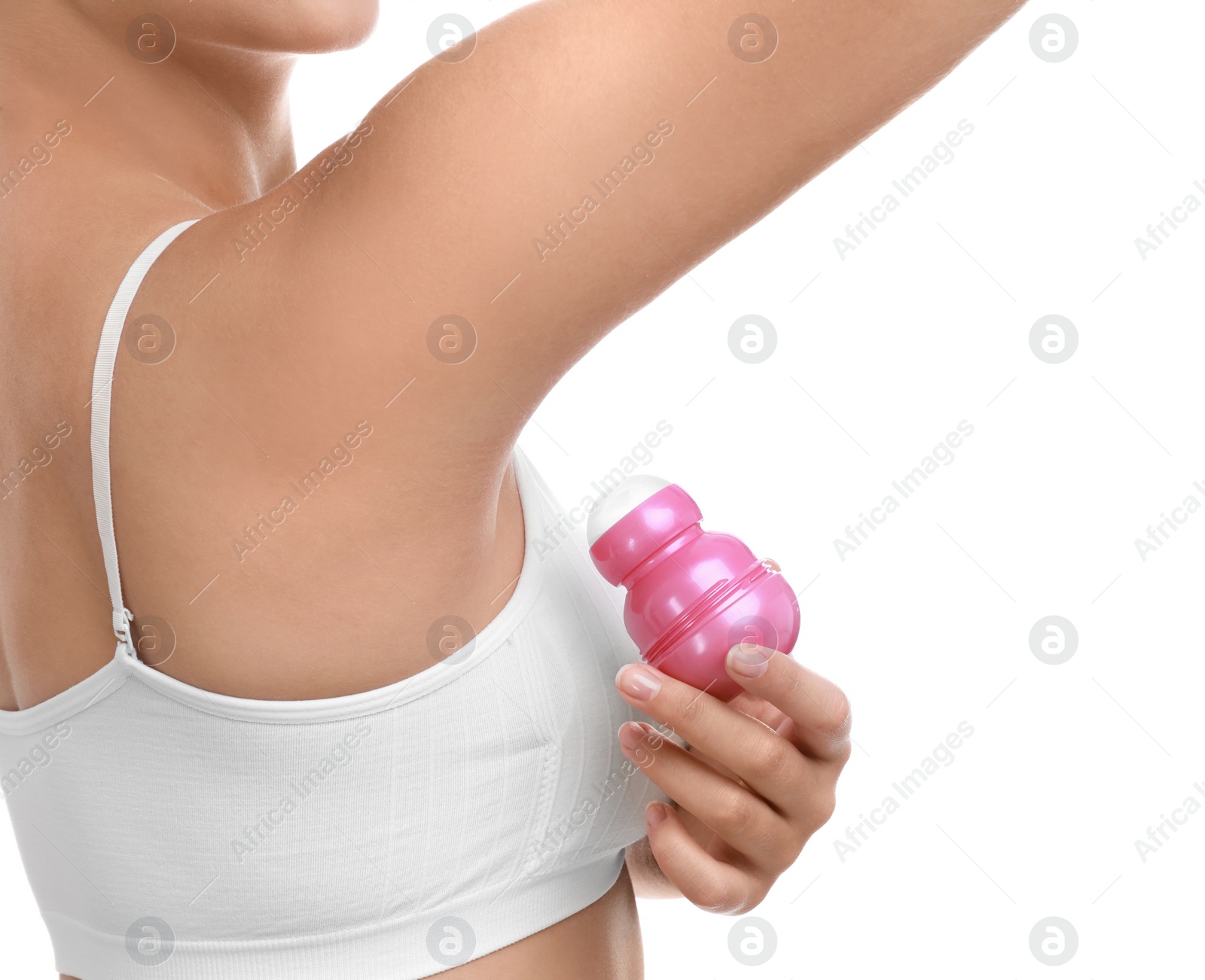 Photo of Young woman applying deodorant to armpit on white background, closeup