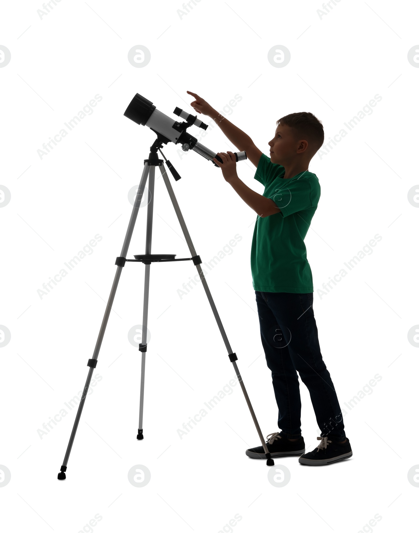 Photo of Cute little boy with telescope pointing at something on white background