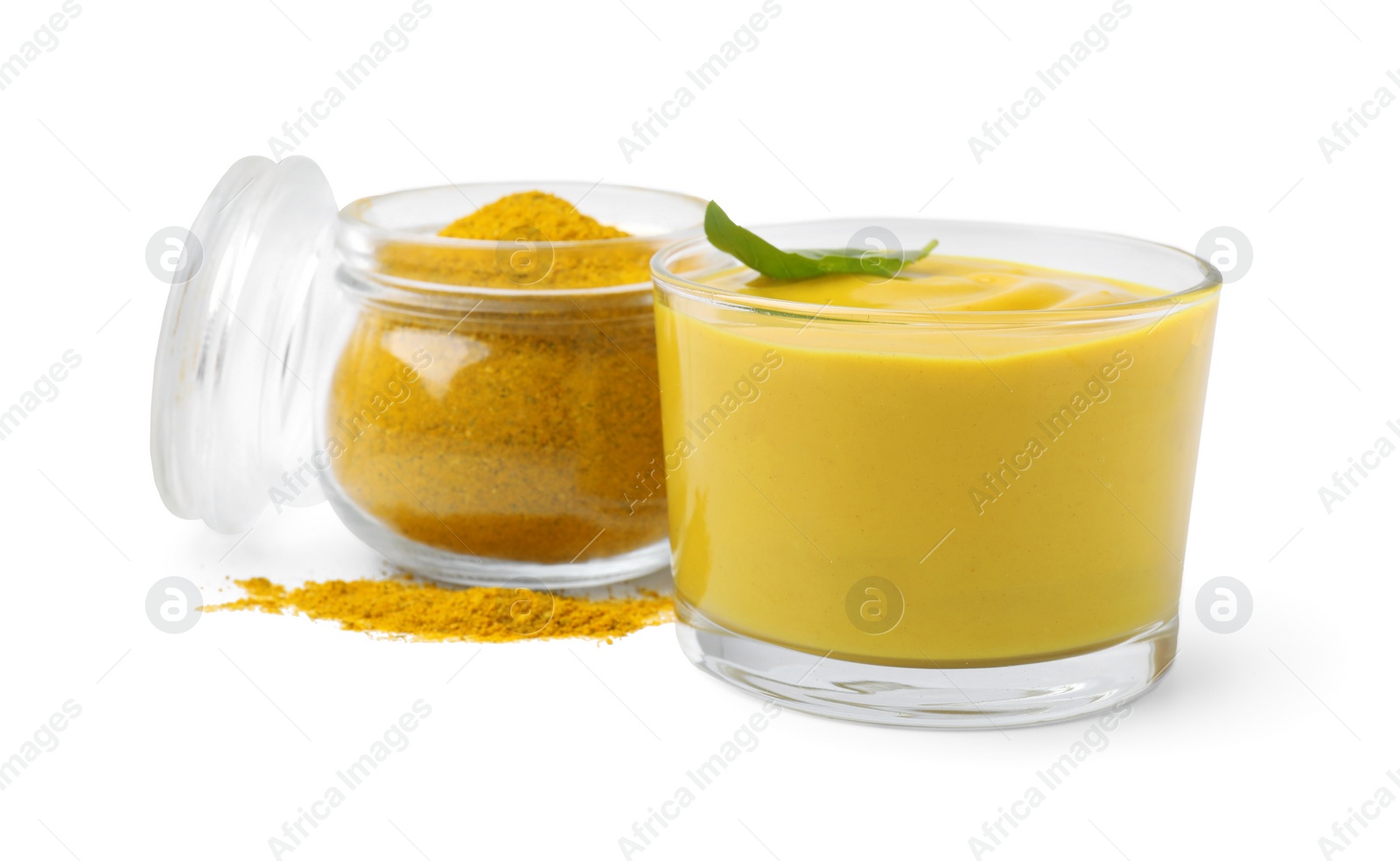 Photo of Tasty curry sauce, powder and basil leaf isolated on white