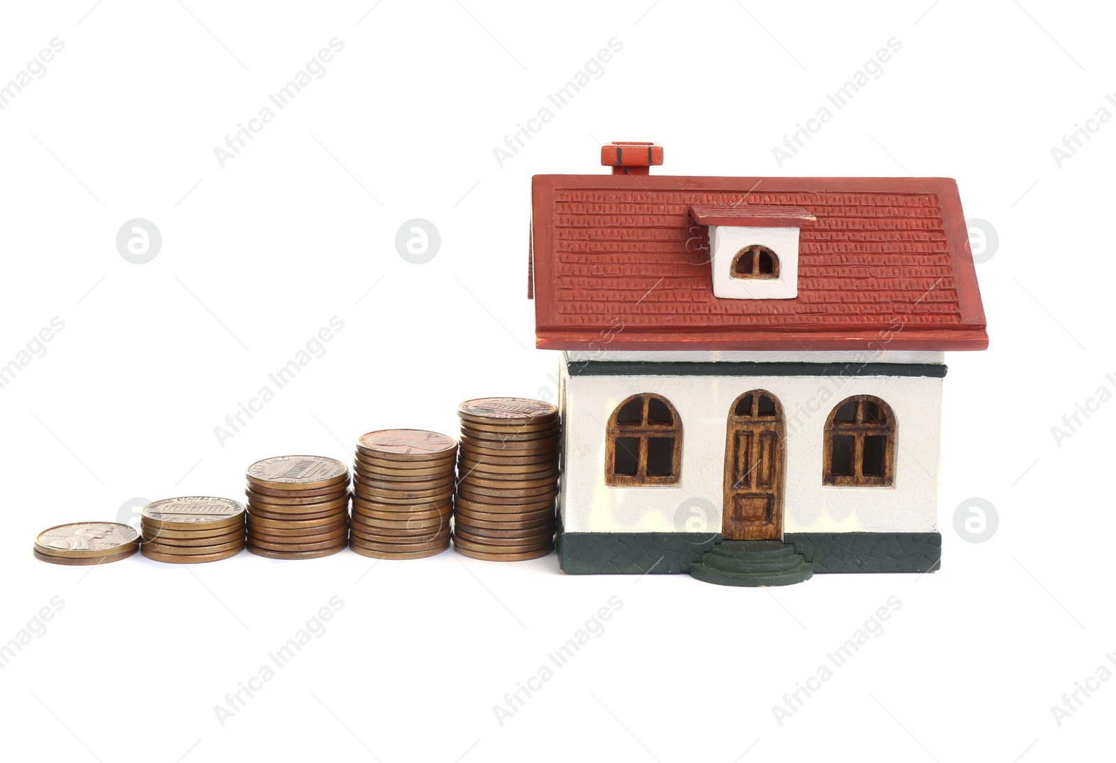 Photo of House model and coins isolated on white