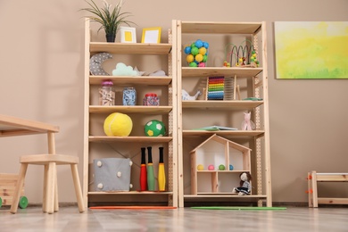 Photo of Storage for toys in colorful child's room. Idea for interior design