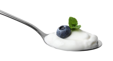 Photo of Spoon with yogurt, blueberry and mint isolated on white