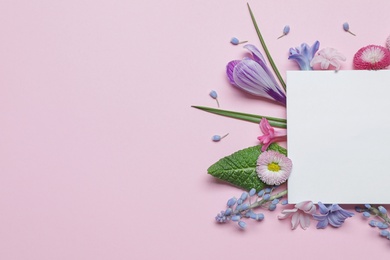 Photo of Flat lay composition with spring hyacinth flowers and blank card on color background, space for text