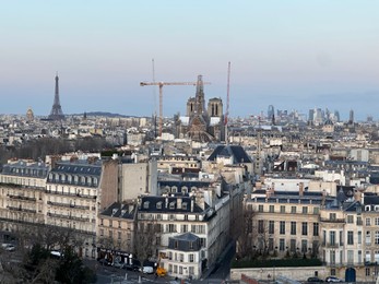 Beautiful buildings and Eiffel tower in Paris, view from hotel window