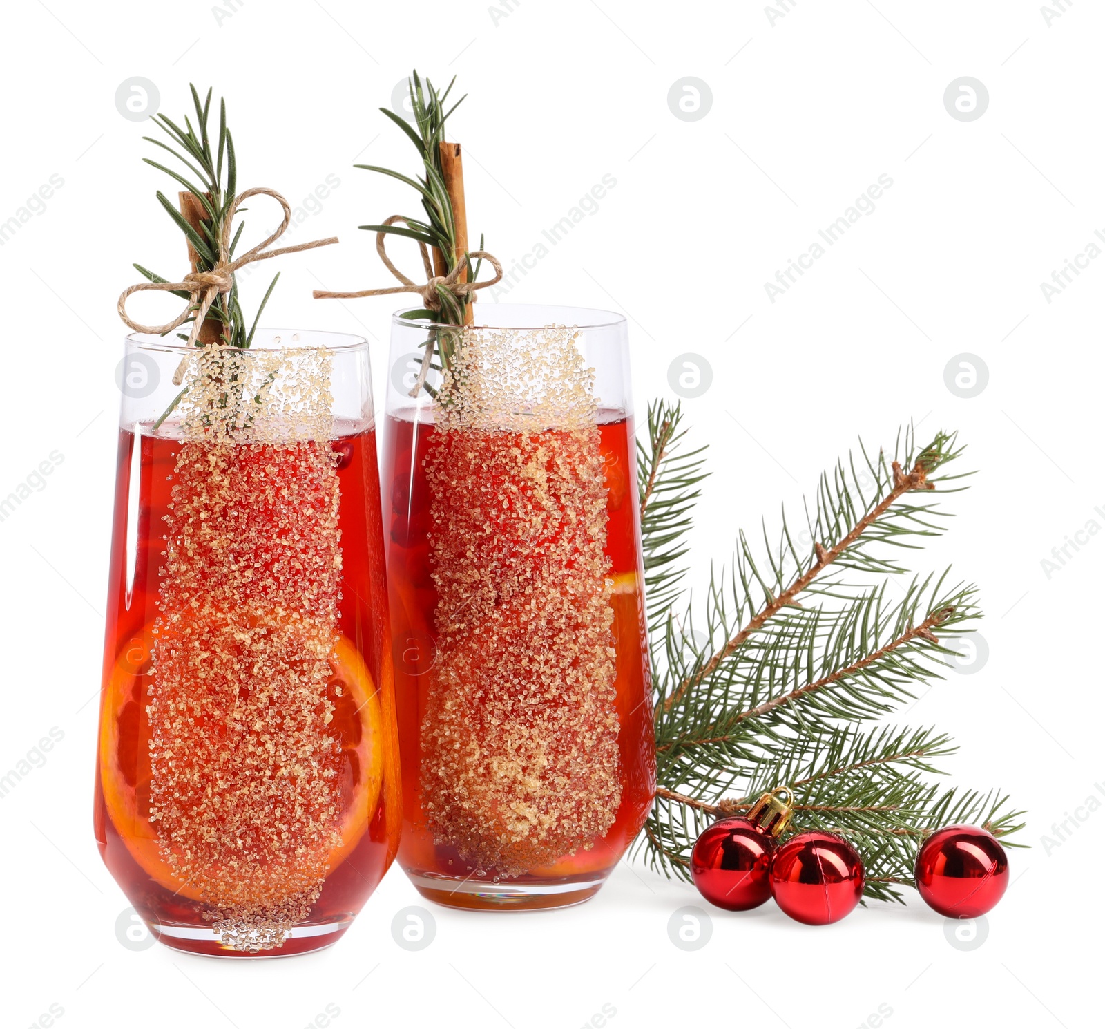 Photo of Christmas Sangria cocktail in glasses and festive decor isolated on white