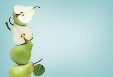 Image of Fresh ripe pears on pale light blue background, space for text