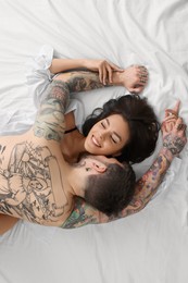 Photo of Passionate couple having sex on bed, top view