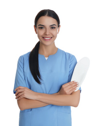 Photo of Female orthopedist showing insole on white background