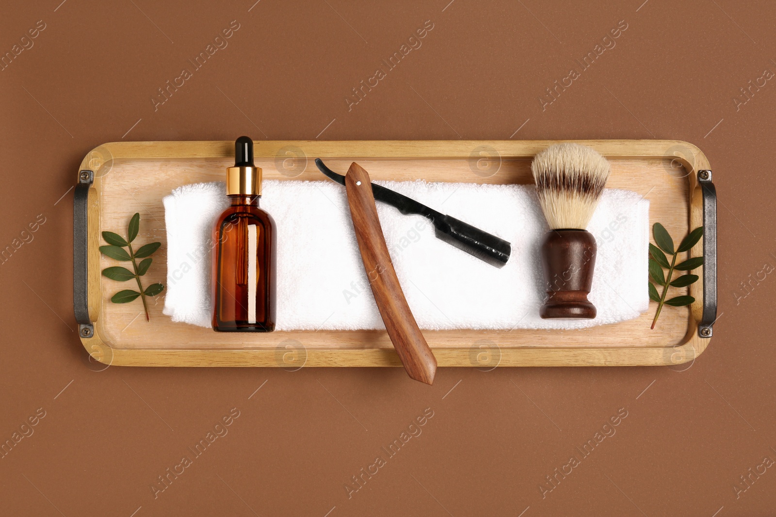 Photo of Set of men's shaving tools on brown background, top view