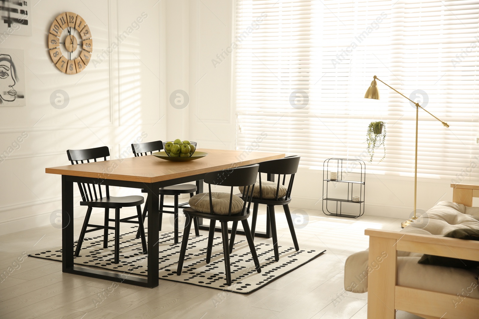 Photo of Stylish wooden dining table and chairs in room. Interior design