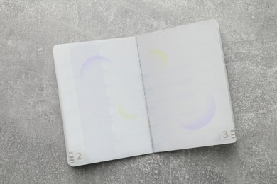 Photo of Blank passport on grey table , top view