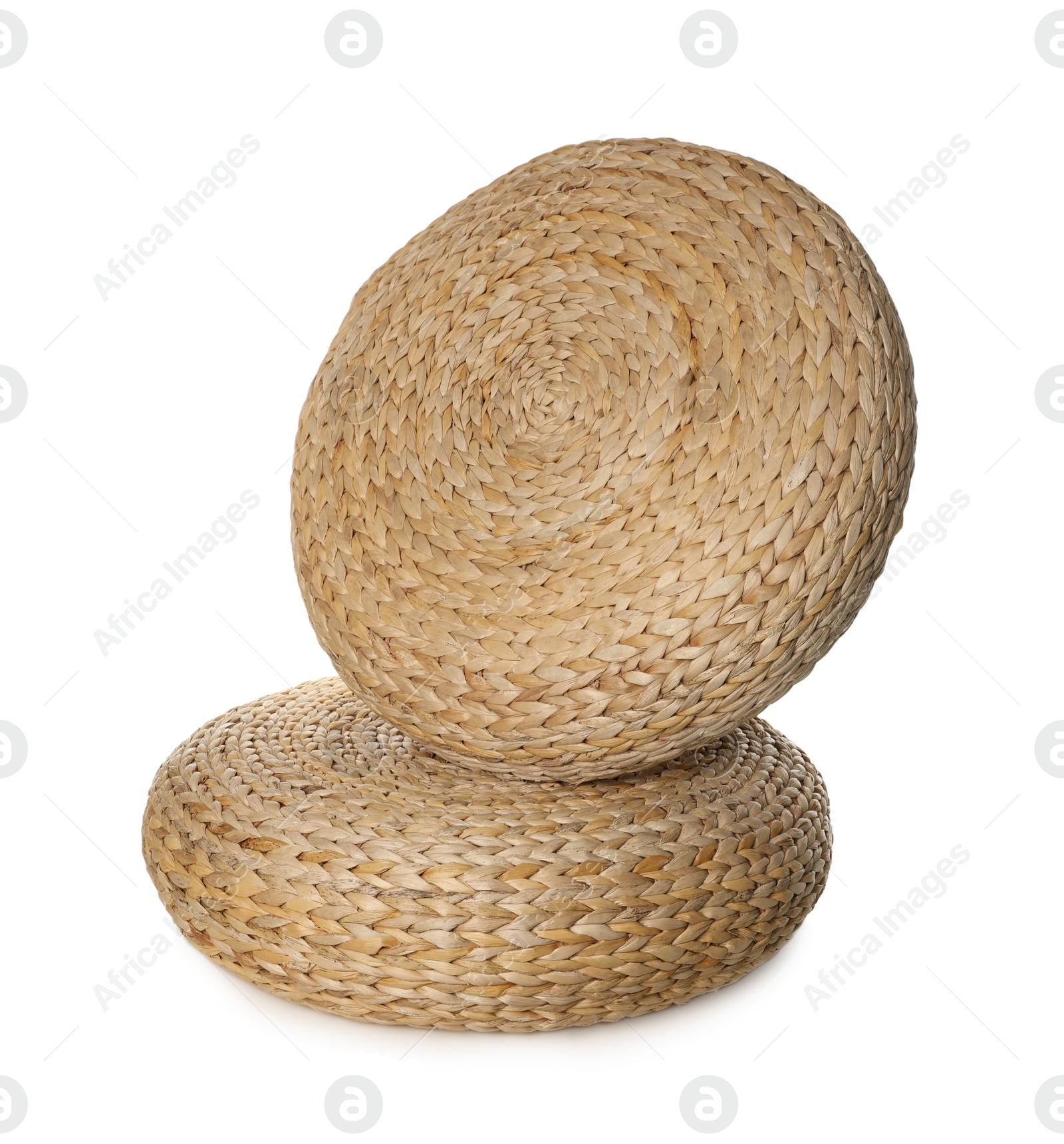 Photo of Two stylish wicker poufs on white background