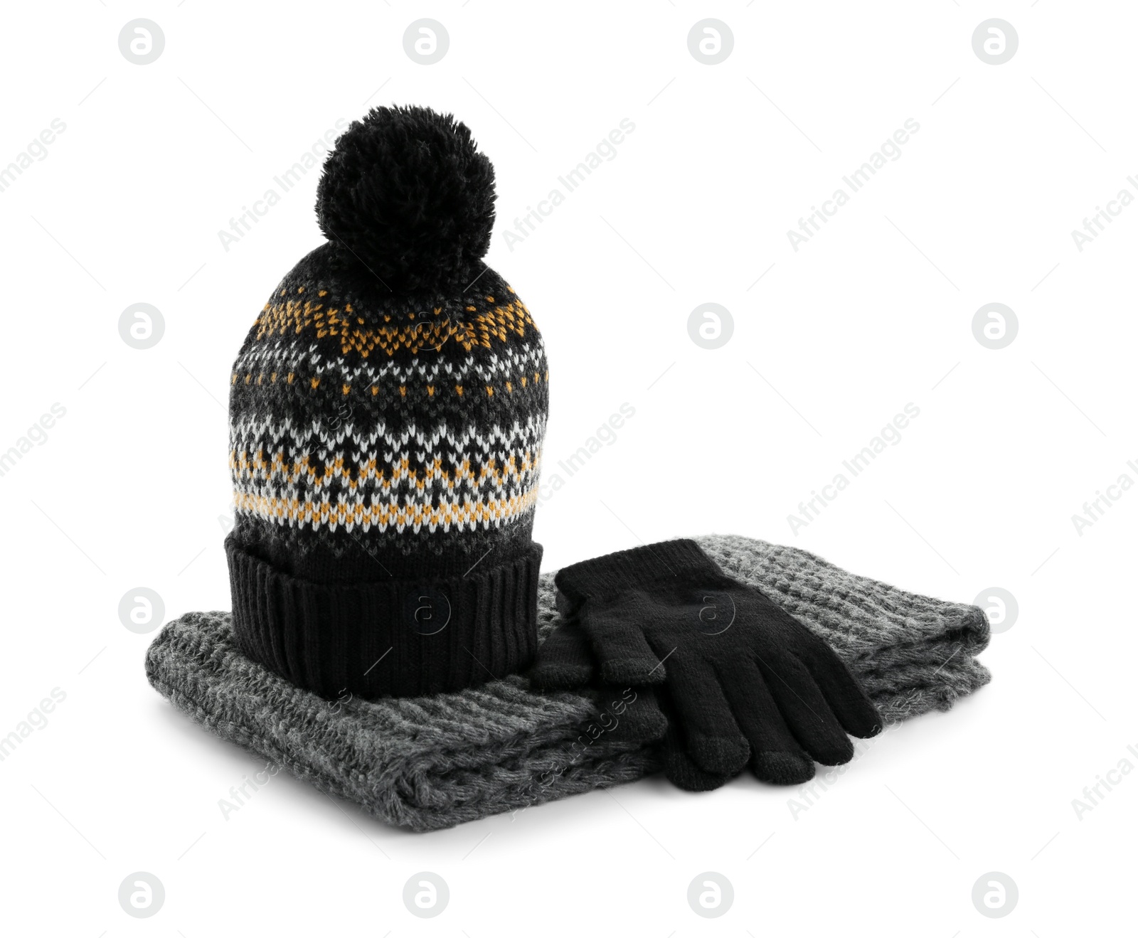 Photo of Woolen gloves, scarf and hat on white background