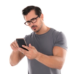 Photo of Young man with glasses using mobile phone on white background. Vision problem