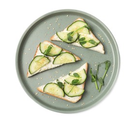 Photo of Tasty cucumber sandwiches with sesame seeds and pea microgreens on white background, top view