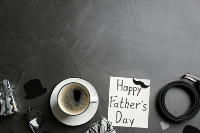 Photo of Flat lay composition with greeting card on grey background, space for text. Happy Father's Day