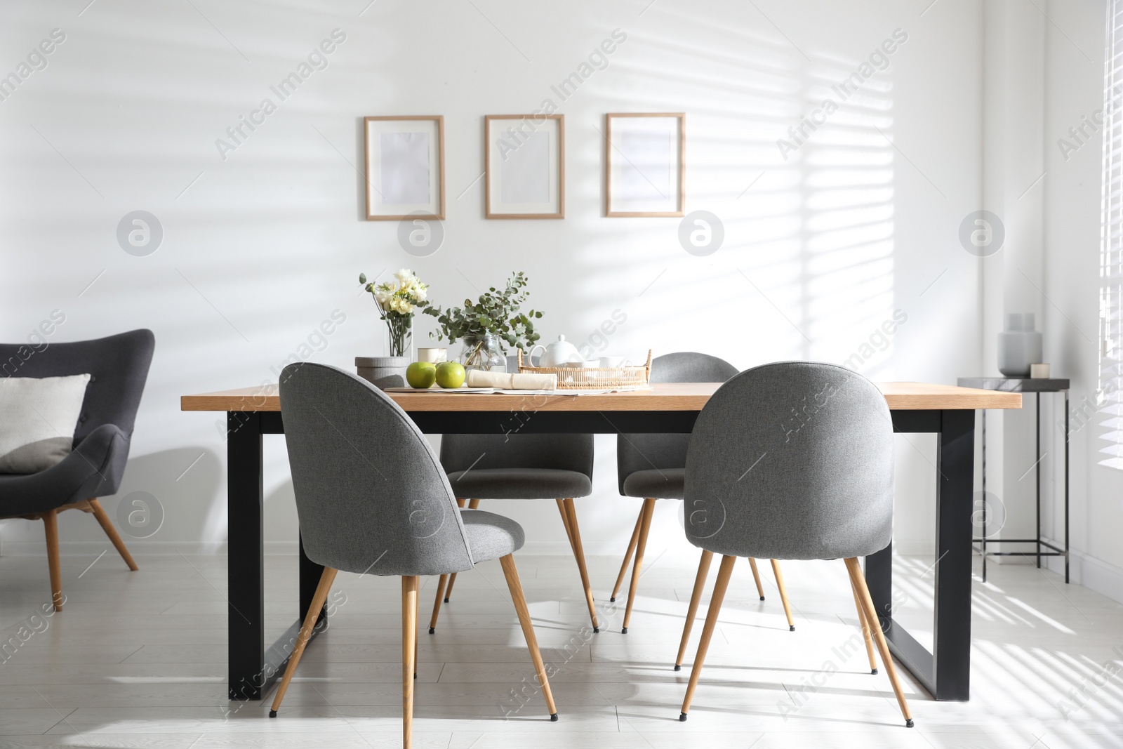 Photo of Stylish room interior with table and chairs. Idea for design