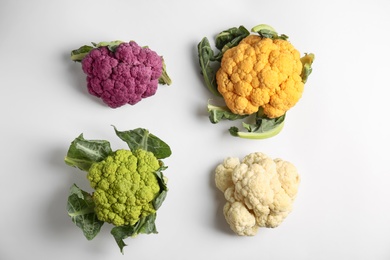 Colorful cauliflower cabbages on white background. Healthy food