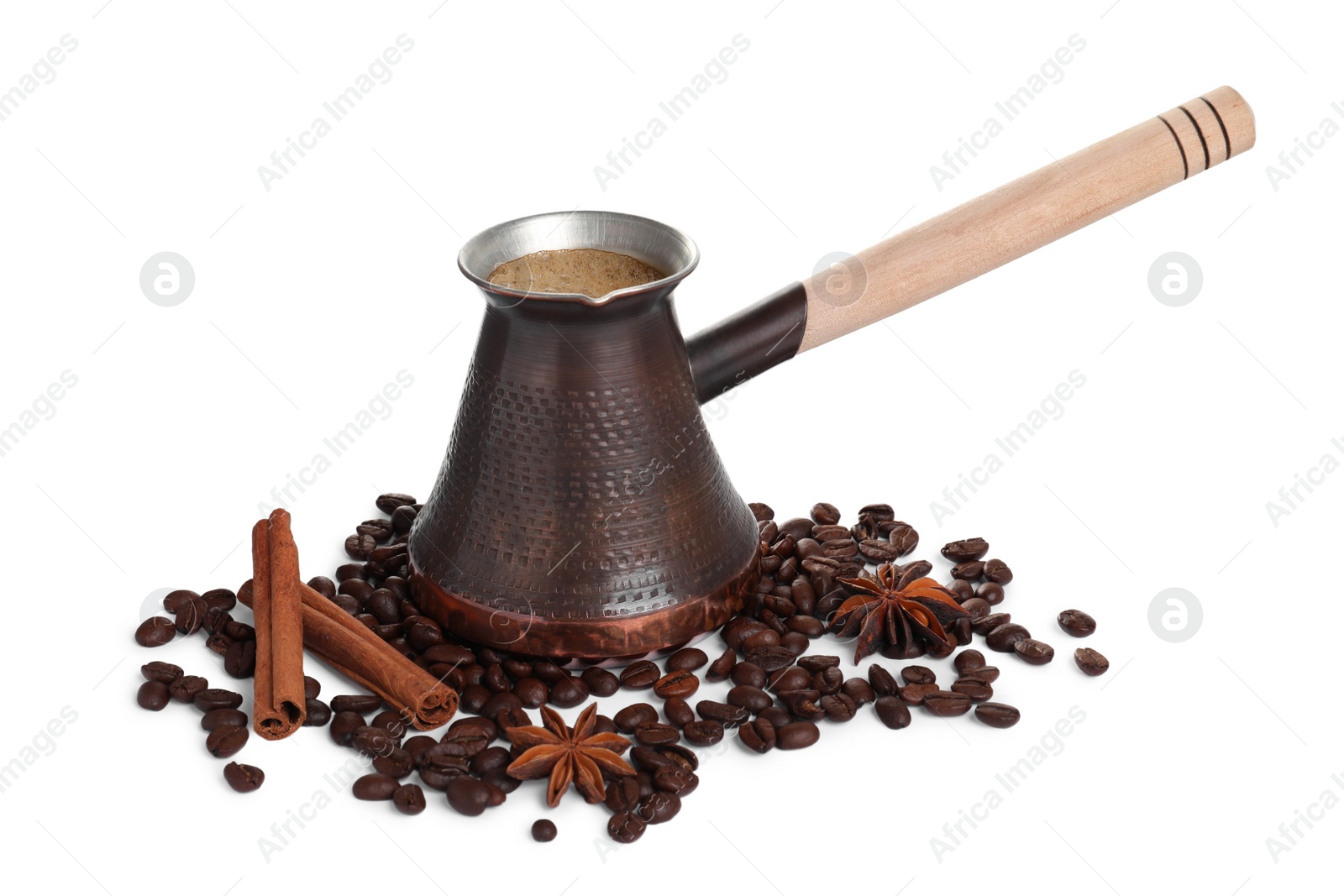 Photo of Metal turkish coffee pot with hot drink, beans and spices on white background