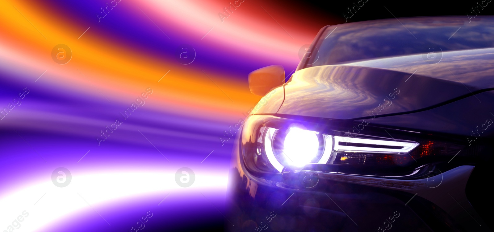 Image of Black modern car and speed light trails, motion blur effect. Banner design