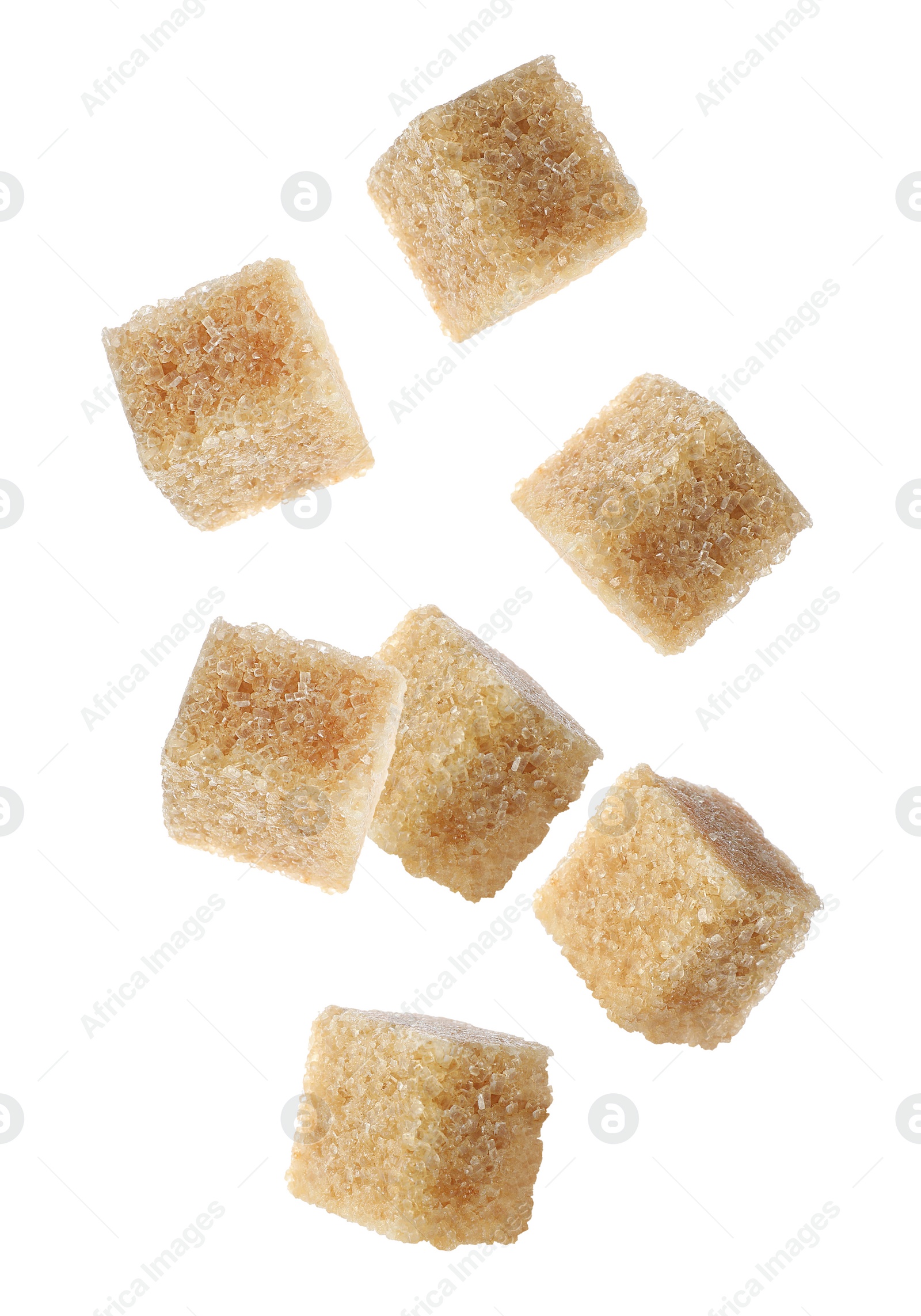 Image of Flying cubes of brown sugar on white background