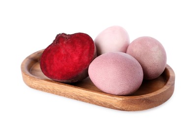 Photo of Colorful Easter eggs painted with natural dye and cut beet on white background
