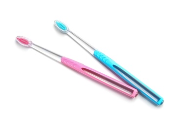 Photo of Color toothbrushes on white background. Dental care