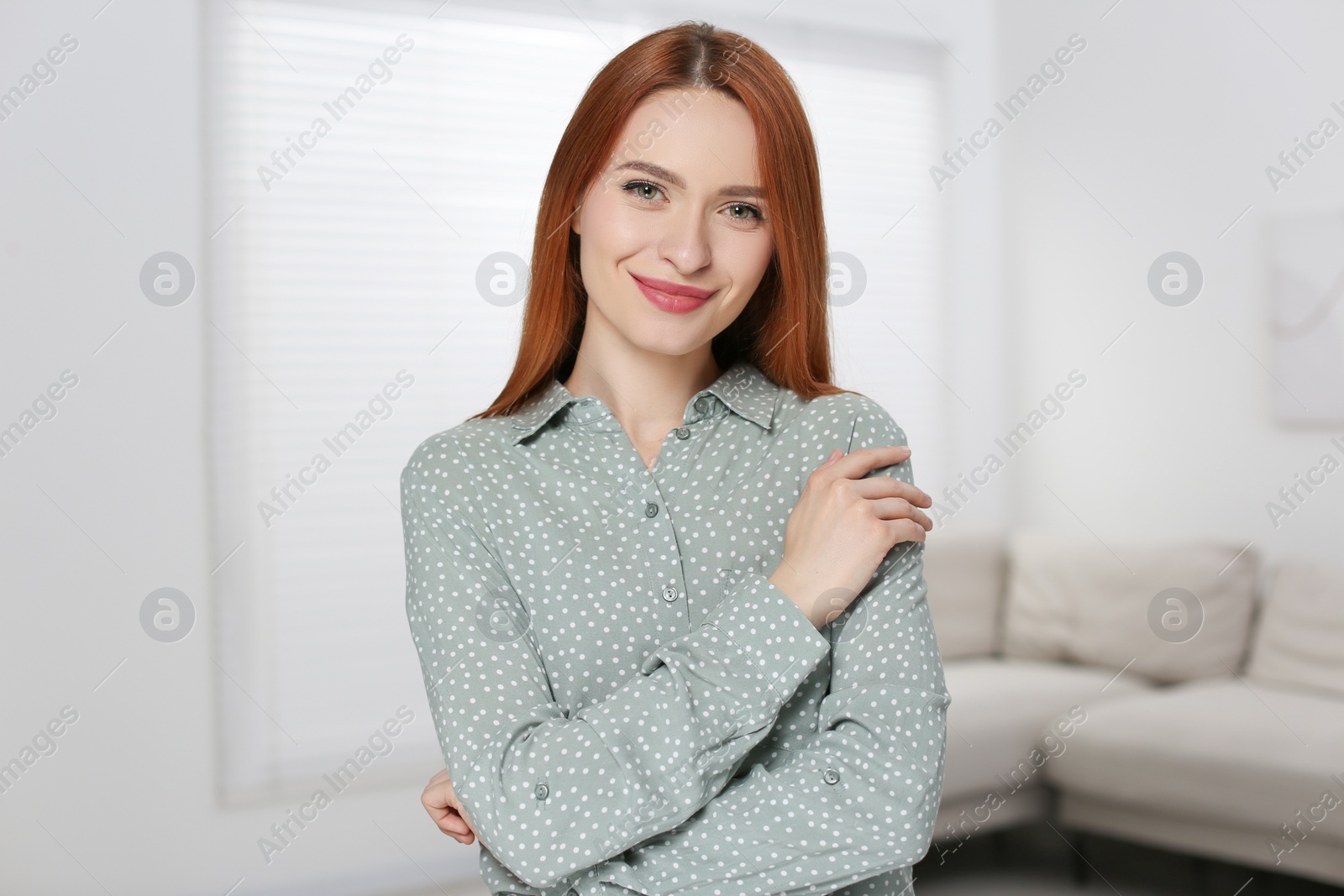 Photo of Portrait of beautiful young woman at home