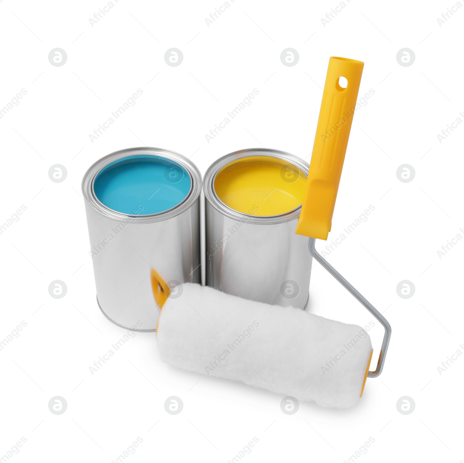 Photo of Cans with different paints and roller on white background