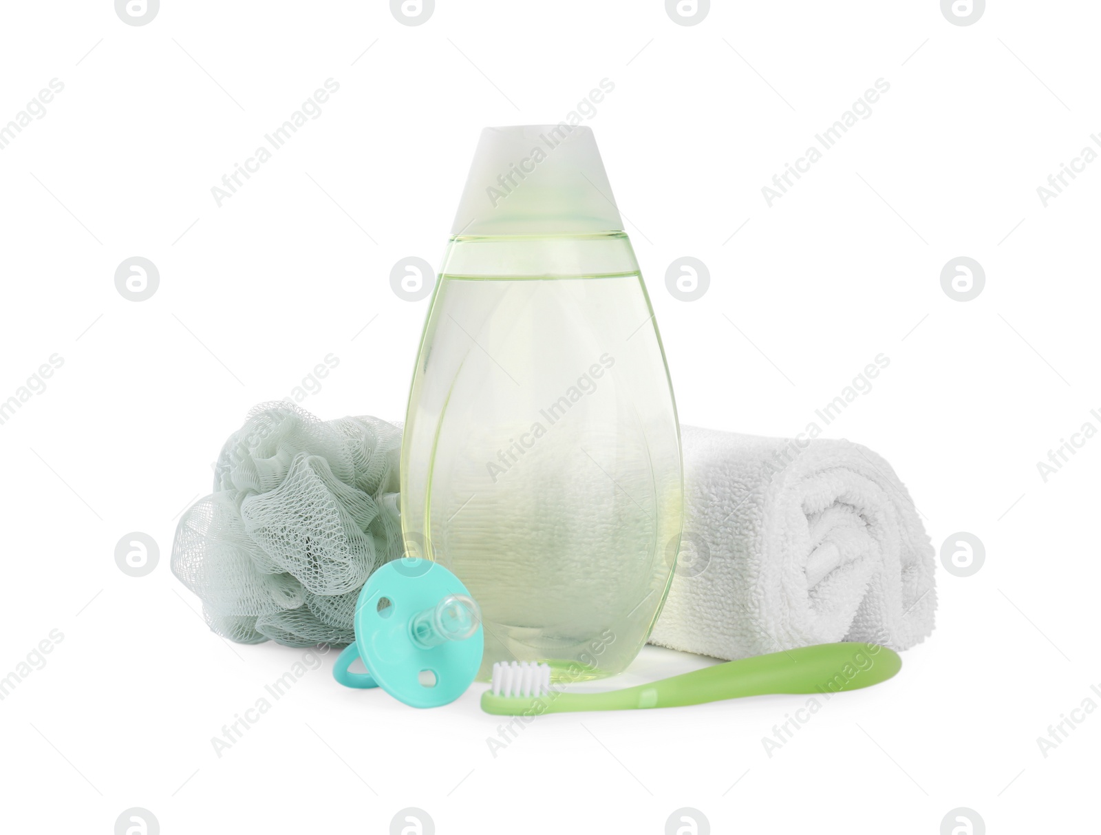 Photo of Green transparent bottle with baby oil and accessories isolated on white