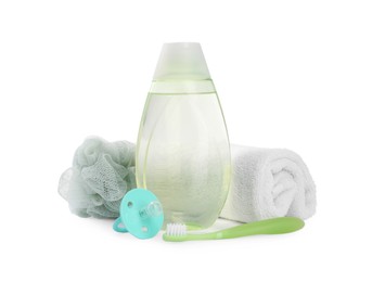 Photo of Green transparent bottle with baby oil and accessories isolated on white