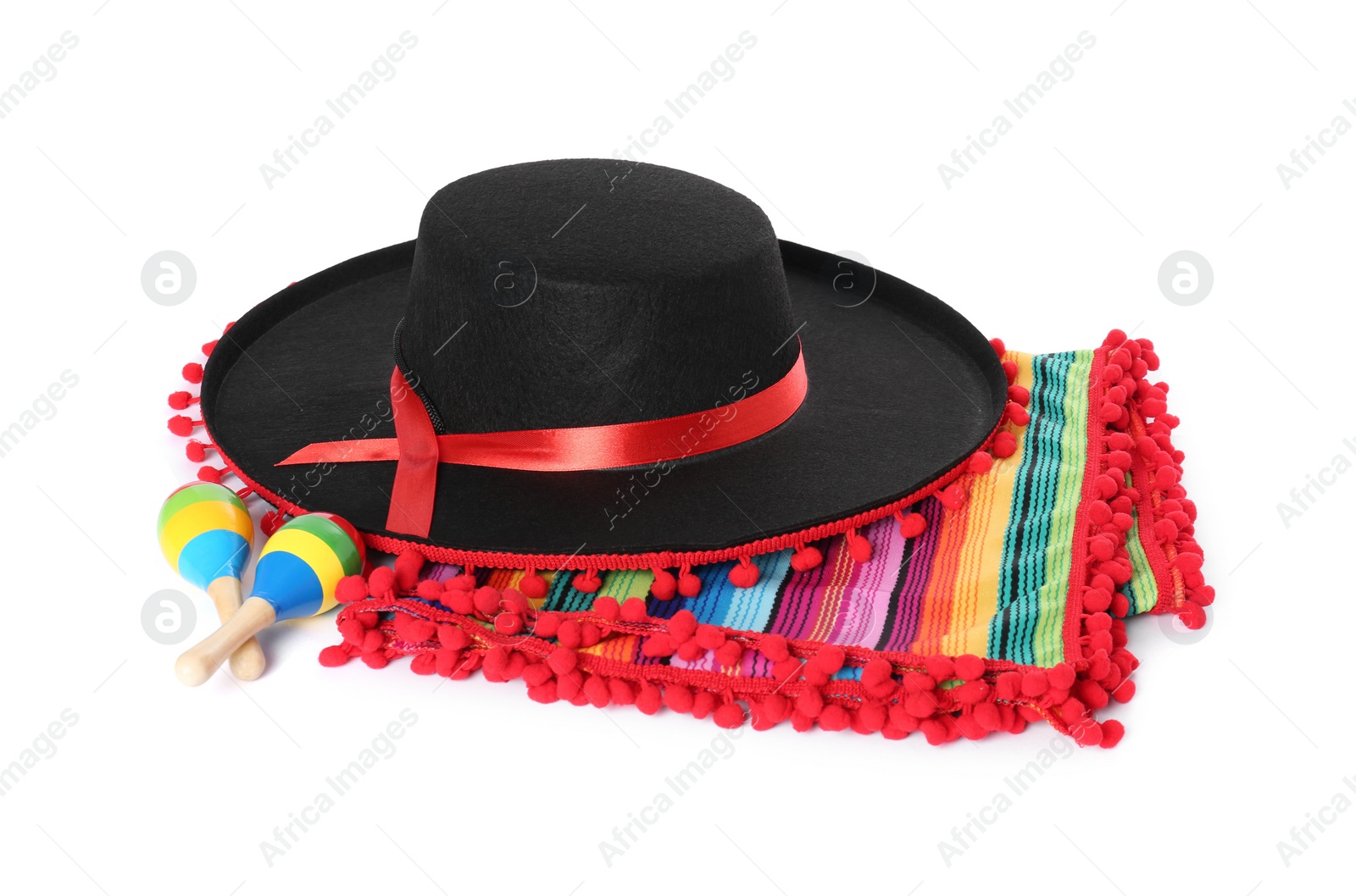 Photo of Mexican sombrero hat, maracas and colorful poncho isolated on white