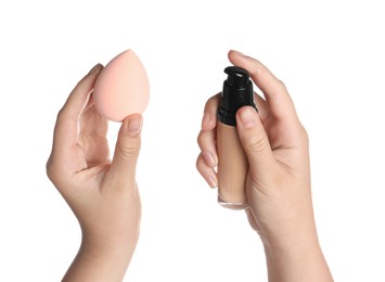 Photo of Woman holding bottle with skin foundation and makeup sponge on white background, closeup
