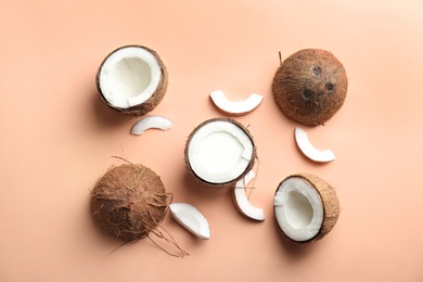 Composition with coconut milk and fresh nuts on color background