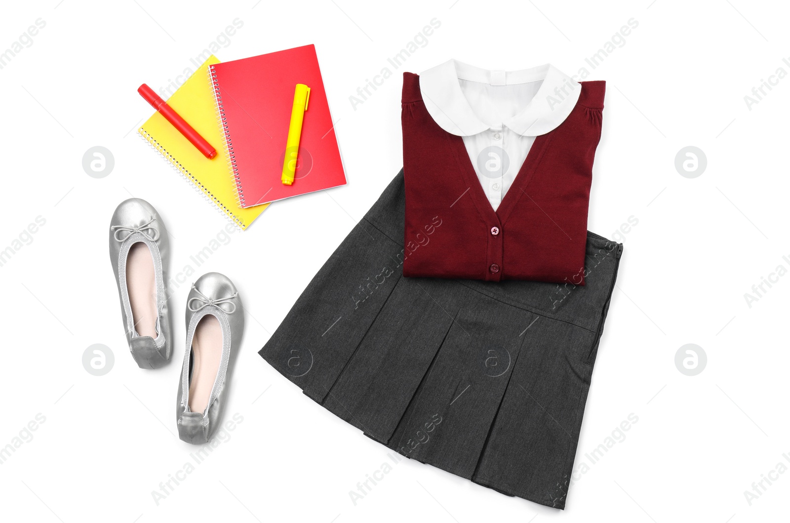 Photo of Stylish school uniform and stationery on white background, top view