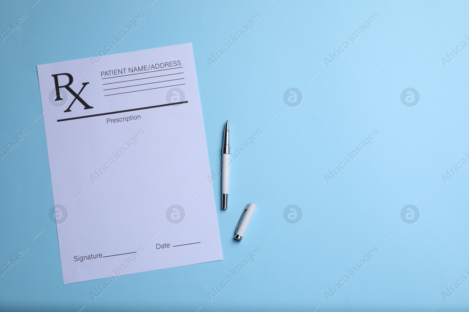 Photo of Medical prescription form and pen on light blue background, top view. Space for text