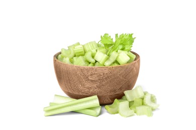 Wooden bowl of fresh cut celery isolated on white