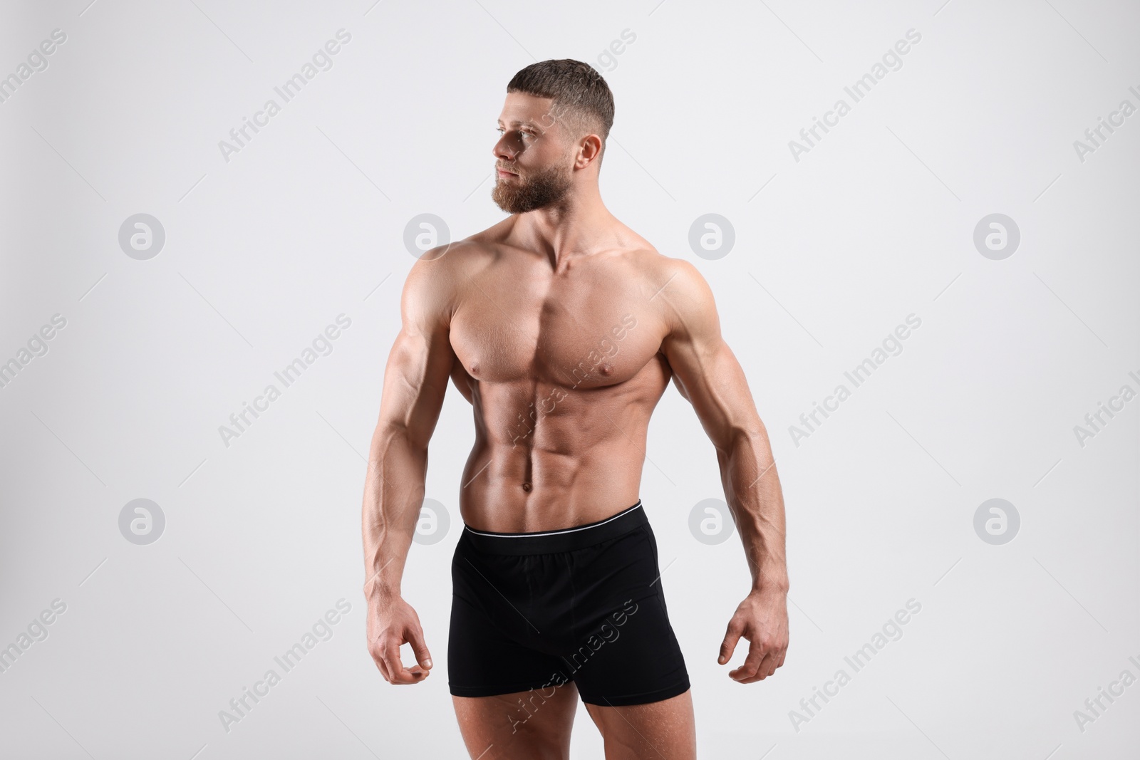 Photo of Young man is stylish black underwear on light grey background