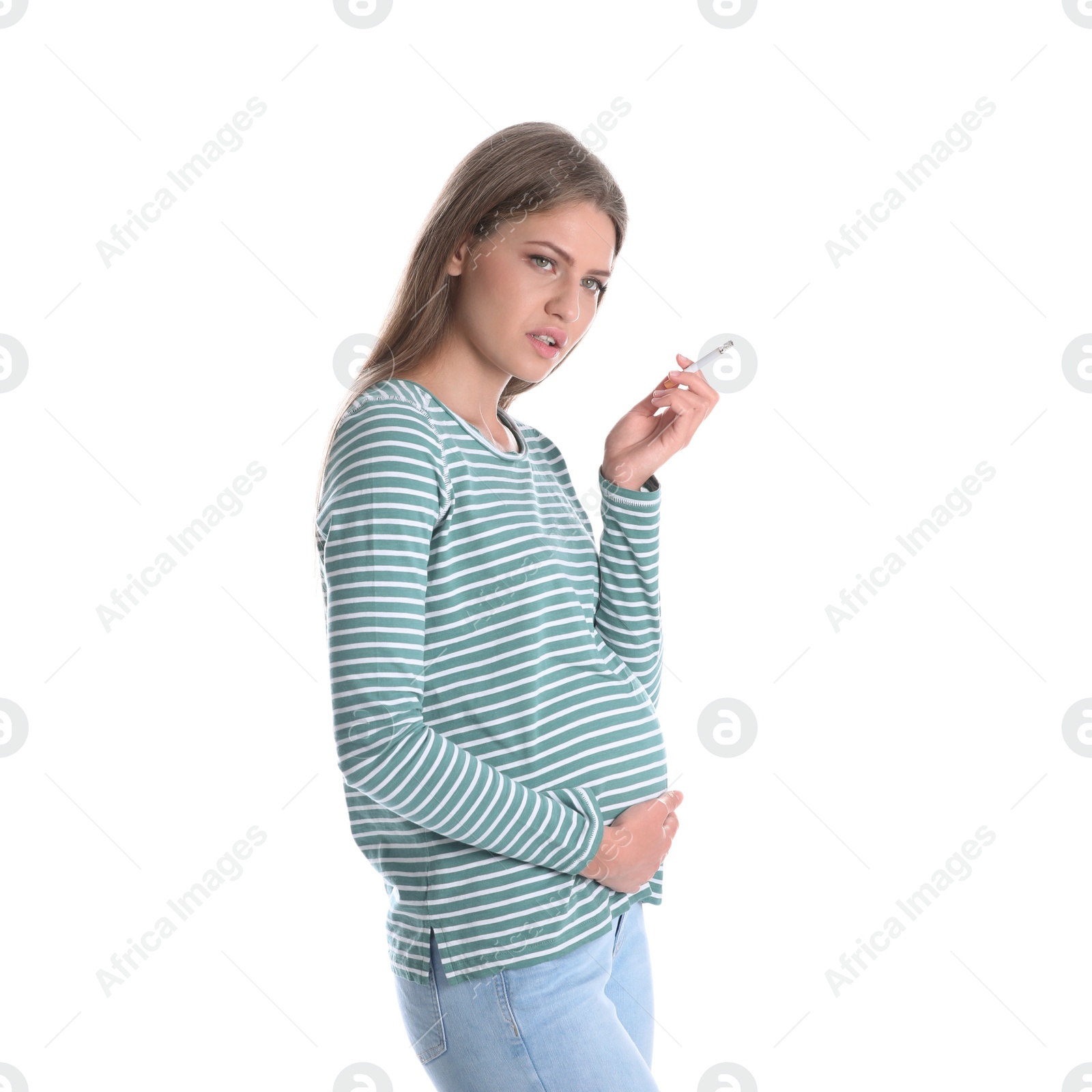 Photo of Young pregnant woman smoking cigarette on white background. Harm to unborn baby