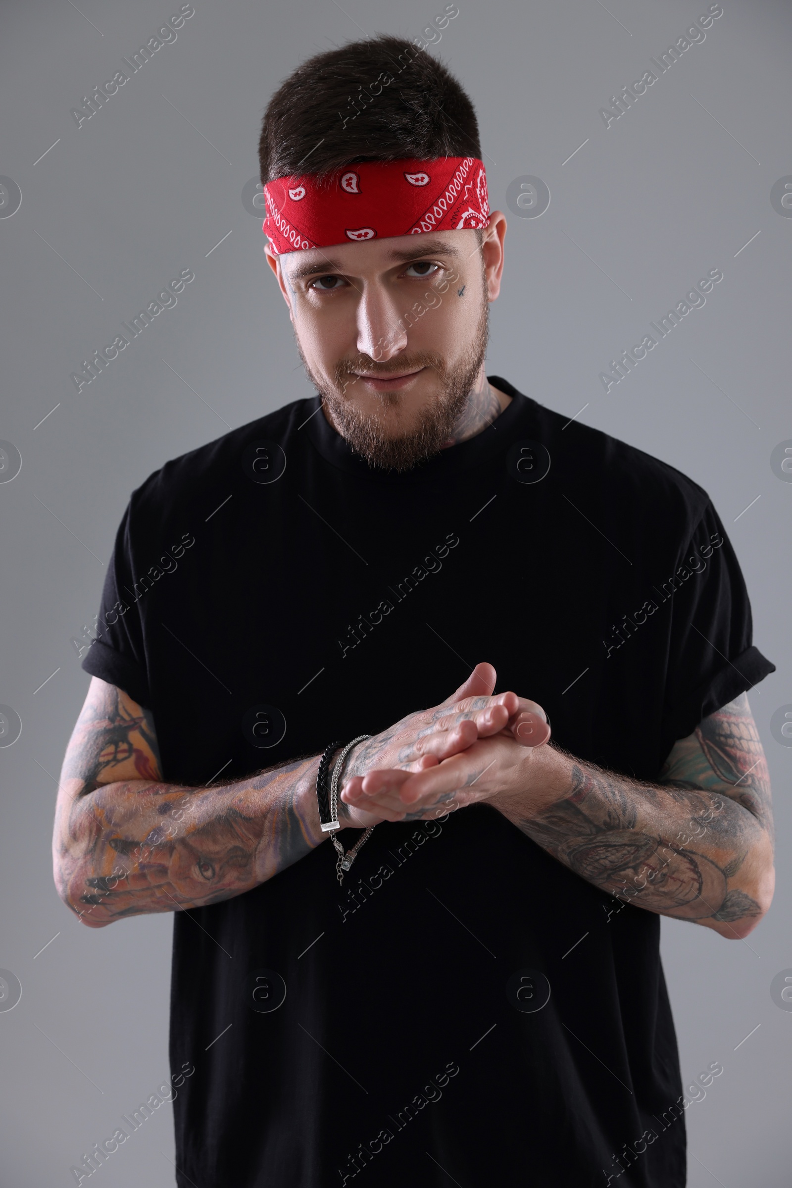 Photo of Portrait of handsome hipster man on light grey background