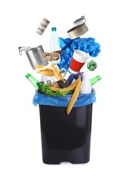Image of Different garbage falling into trash bin with rubbish bag on white background